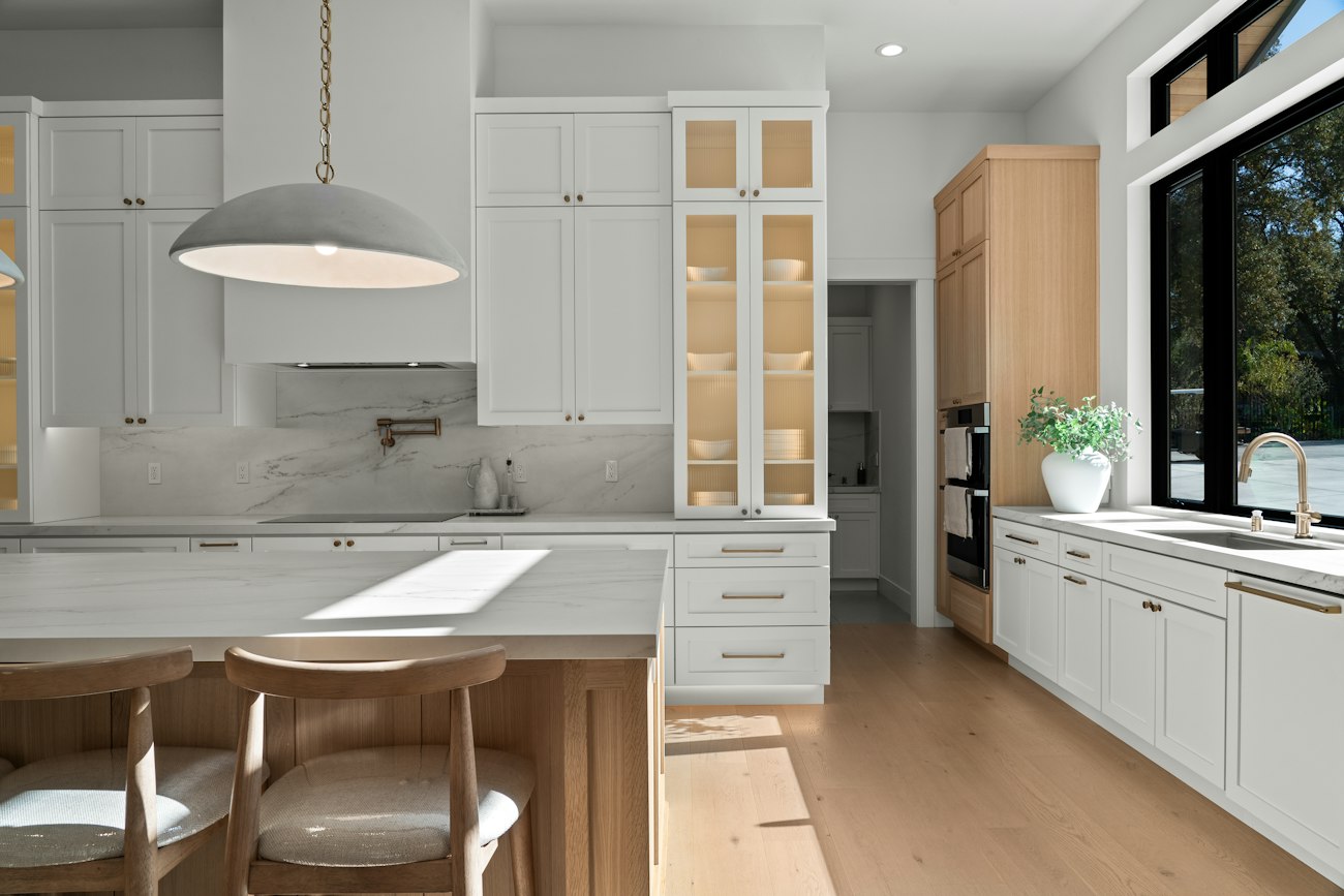A finished white kitchen with an island